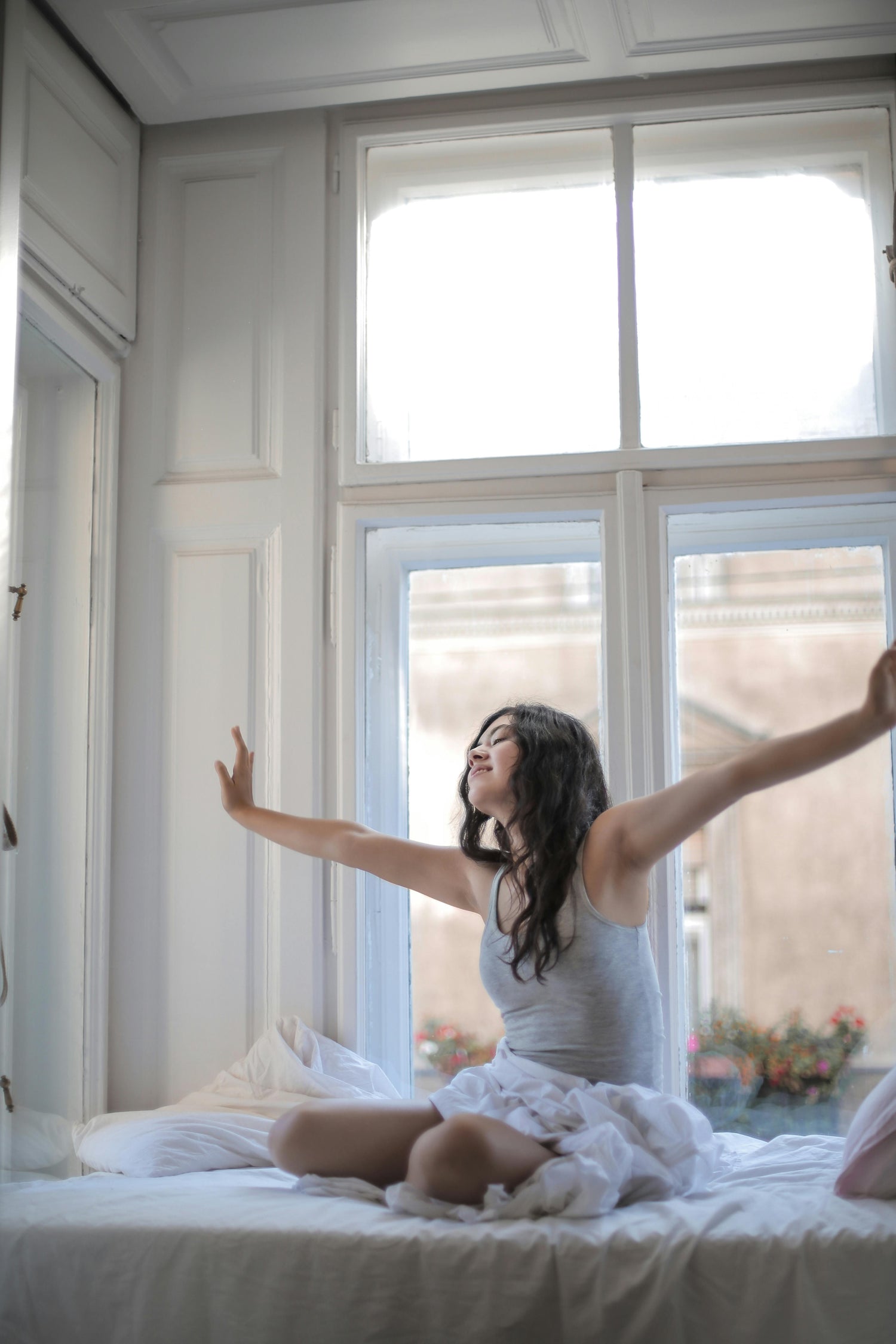 Woman in a mindful morning ritual; morning self-care before work.